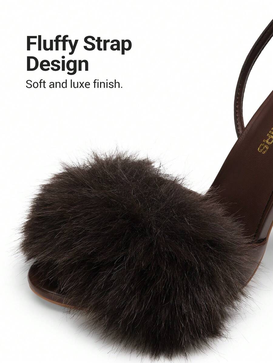 Women's open toe stiletto heeled sandals with fluffy feather detail and adjustable buckle ankle strap.