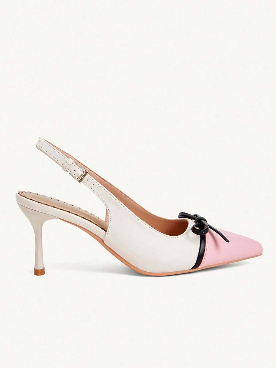 Pointed toe stiletto high heel pumps featuring black lace mesh upper, buckle slingback detail, and sleek slip-on design for weddings and evening wear.