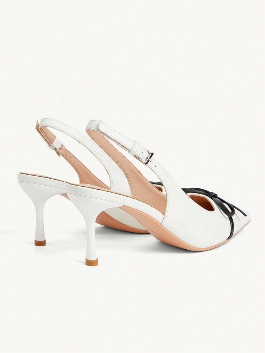 Pointed toe stiletto high heel pumps featuring black lace mesh upper, buckle slingback detail, and sleek slip-on design for weddings and evening wear.