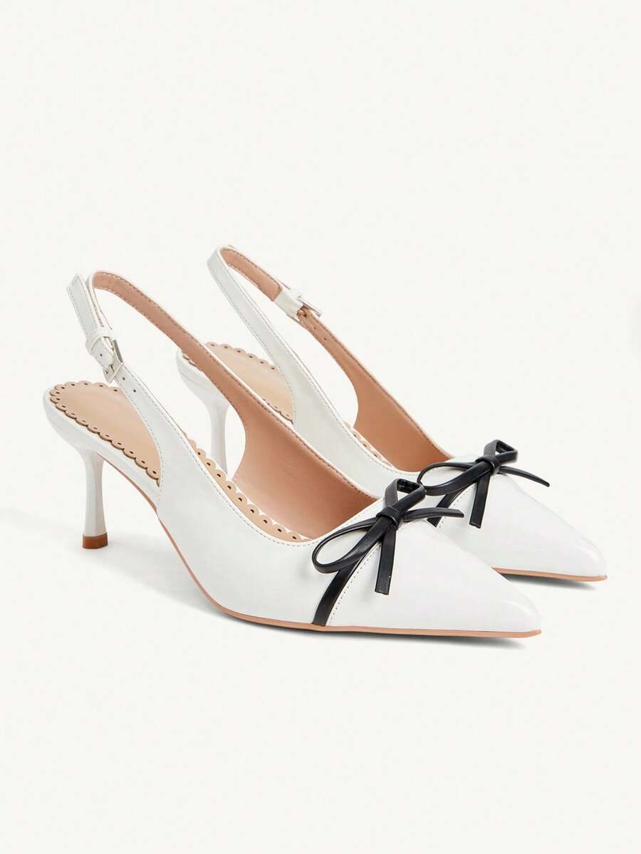 Pointed toe stiletto high heel pumps featuring black lace mesh upper, buckle slingback detail, and sleek slip-on design for weddings and evening wear.