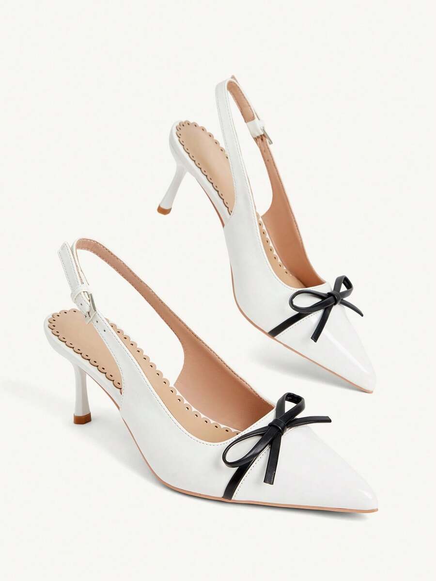 Pointed toe stiletto high heel pumps featuring black lace mesh upper, buckle slingback detail, and sleek slip-on design for weddings and evening wear.