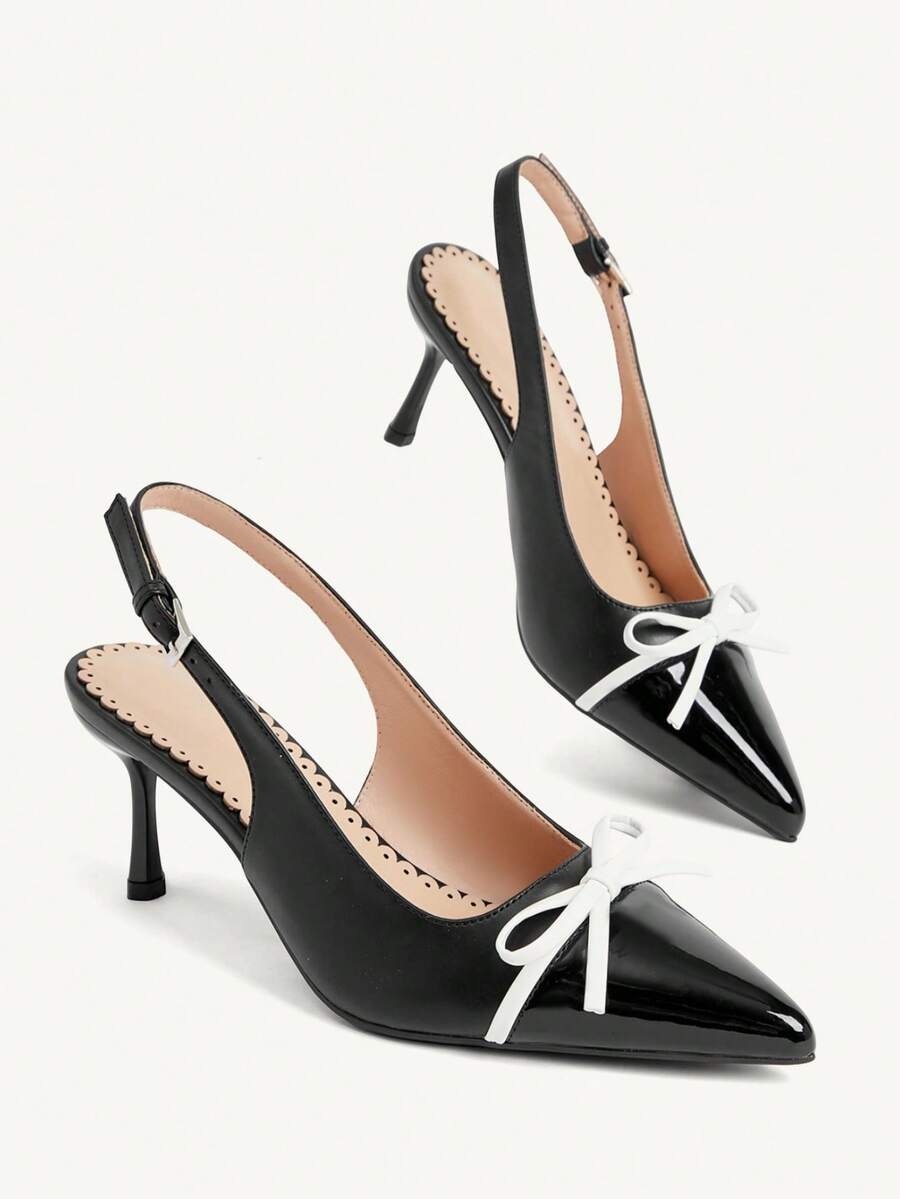 Pointed toe stiletto high heel pumps featuring black lace mesh upper, buckle slingback detail, and sleek slip-on design for weddings and evening wear.