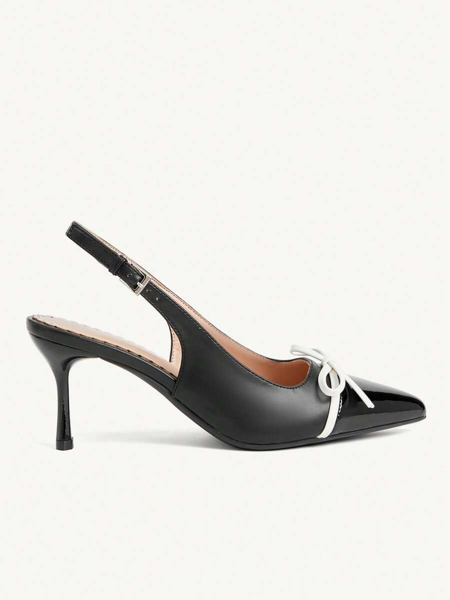Pointed toe stiletto high heel pumps featuring black lace mesh upper, buckle slingback detail, and sleek slip-on design for weddings and evening wear.