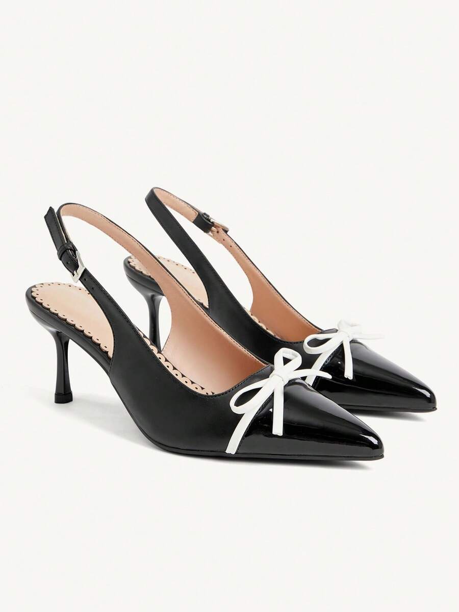 Pointed toe stiletto high heel pumps featuring black lace mesh upper, buckle slingback detail, and sleek slip-on design for weddings and evening wear.