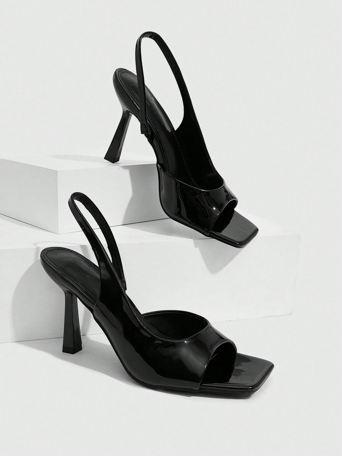 Women's burgundy open toe high heel sandals featuring an embossed finish and slingback strap