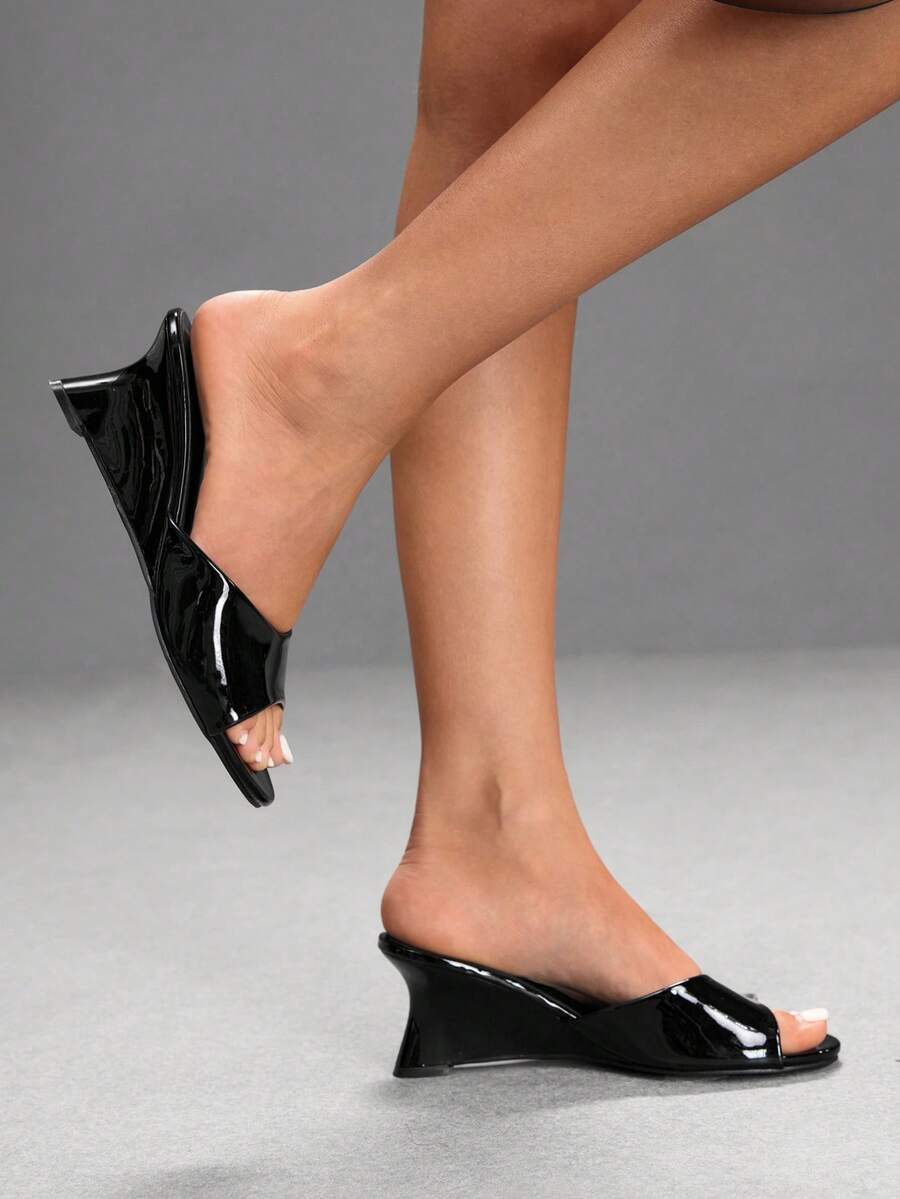 Women's open-toed wedge sandals featuring a smooth PU leather upper, supportive mid wedge heel, and durable rubber sole.