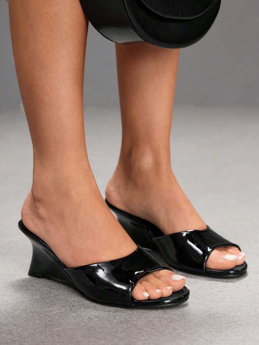 Women's open-toed wedge sandals featuring a smooth PU leather upper, supportive mid wedge heel, and durable rubber sole.