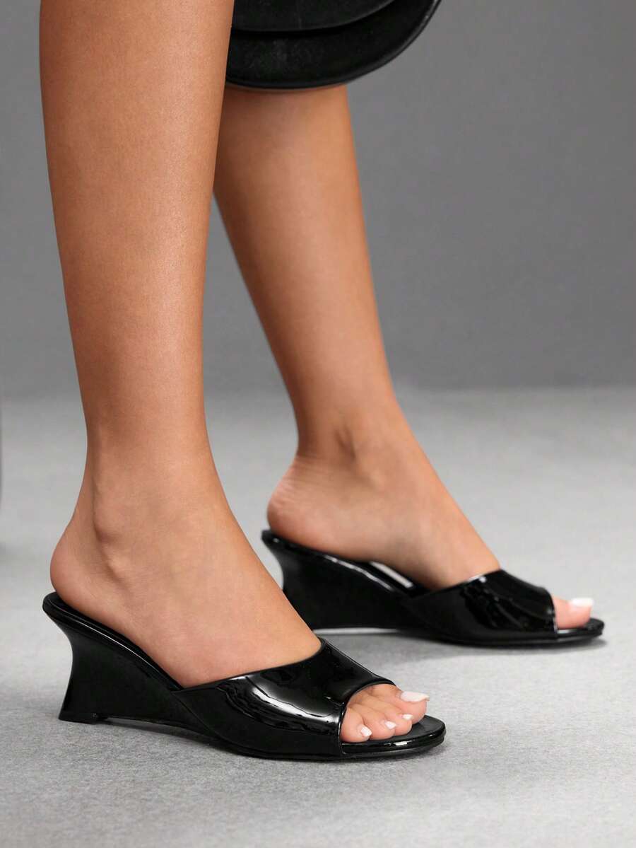 Women's open-toed wedge sandals featuring a smooth PU leather upper, supportive mid wedge heel, and durable rubber sole.