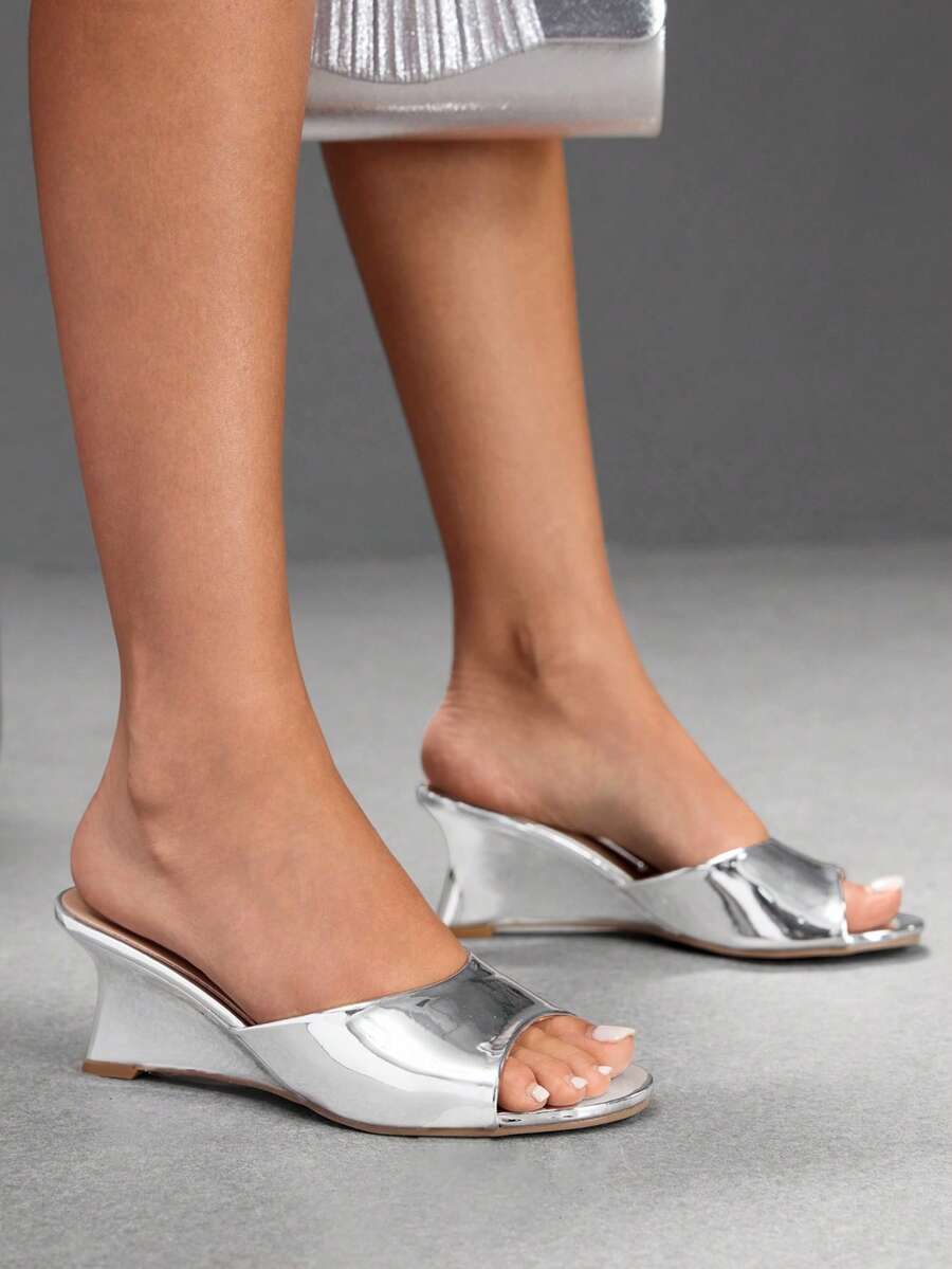 Women's open-toed wedge sandals featuring a smooth PU leather upper, supportive mid wedge heel, and durable rubber sole.