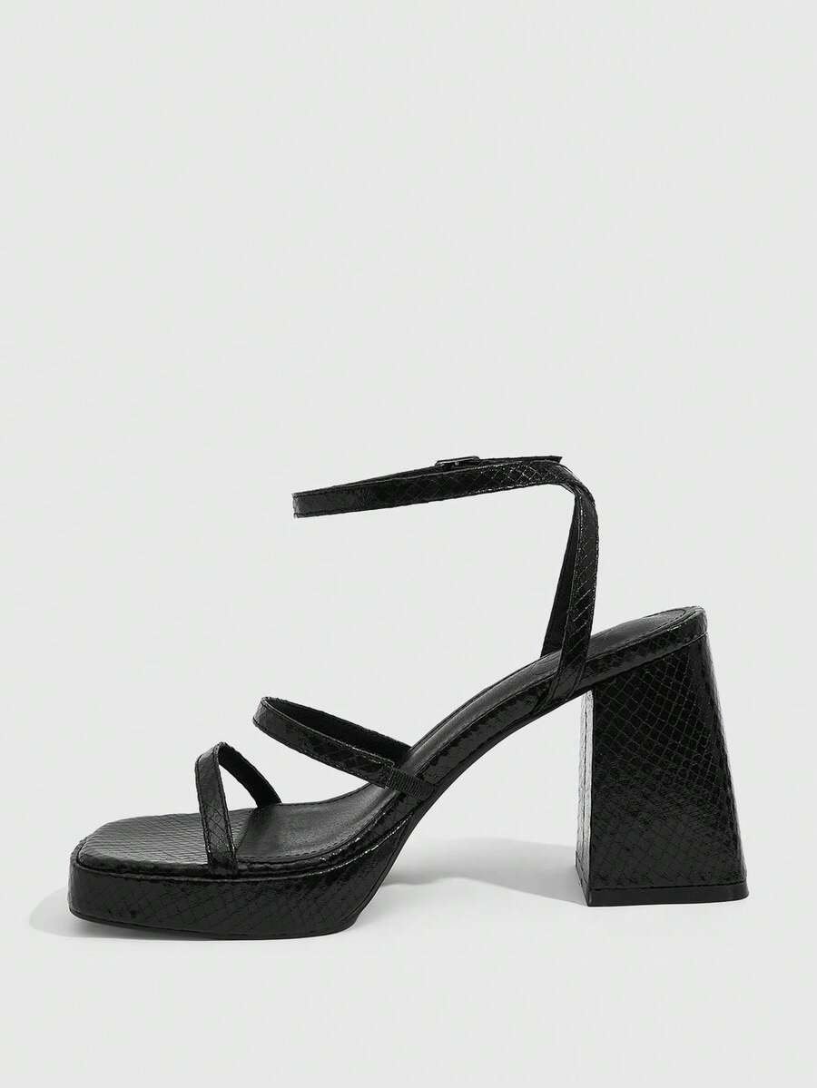 Women's high-heeled sandals with textured pattern, open toe design, chunky heel, and adjustable ankle buckle strap.