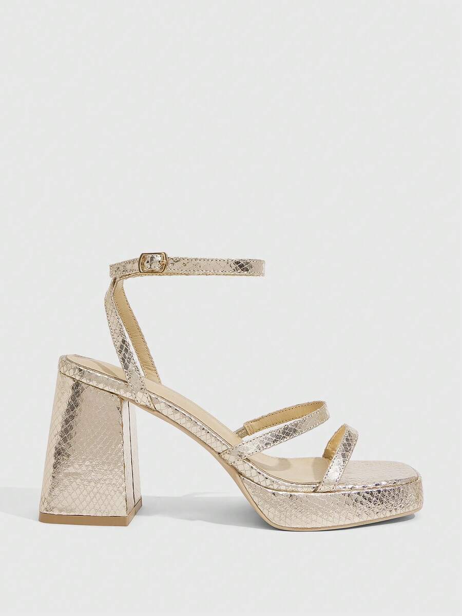 Women's high-heeled sandals with textured pattern, open toe design, chunky heel, and adjustable ankle buckle strap.