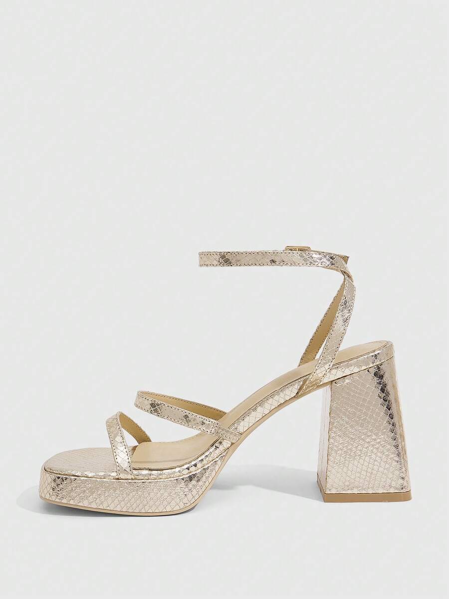 Women's high-heeled sandals with textured pattern, open toe design, chunky heel, and adjustable ankle buckle strap.