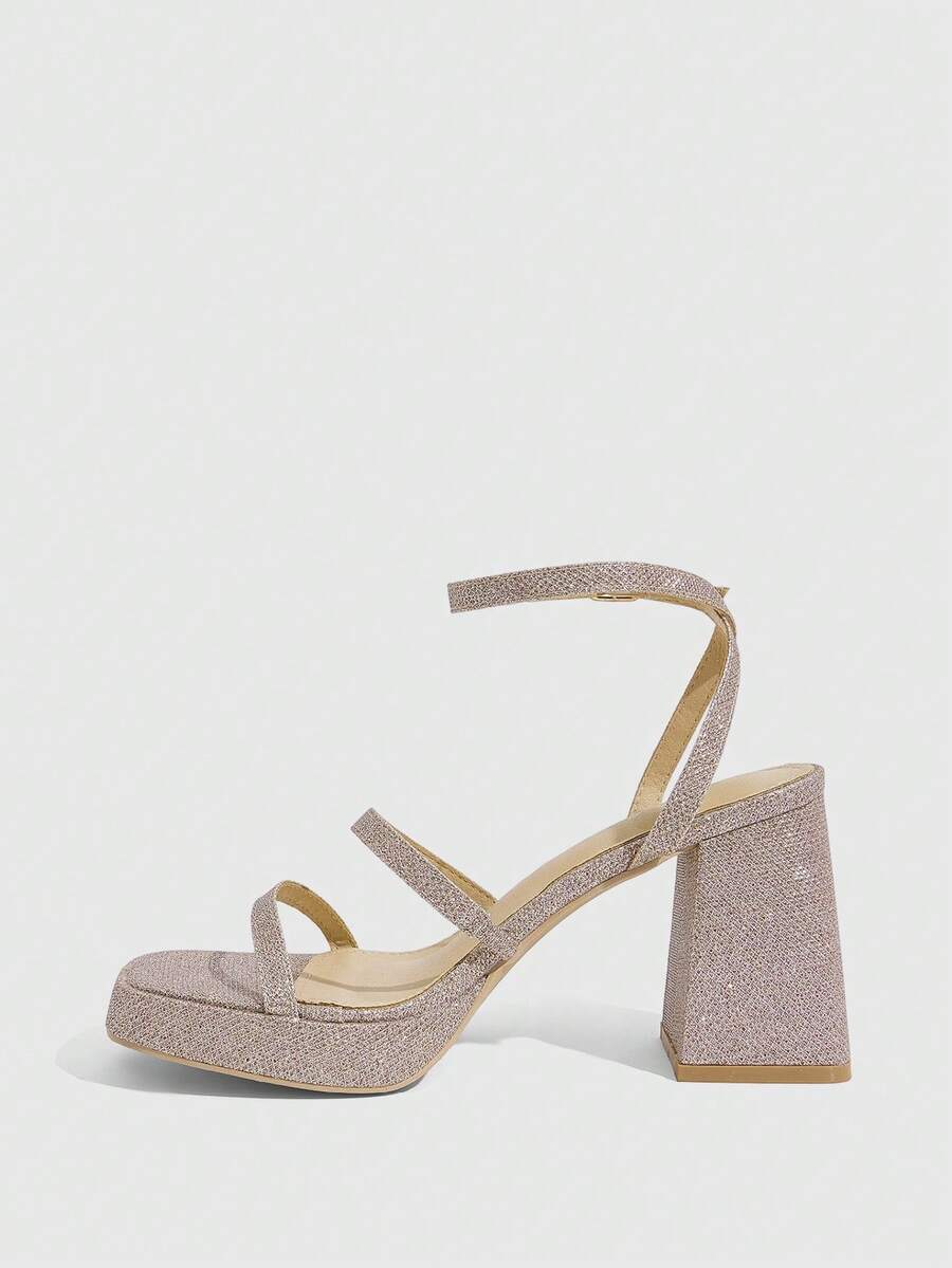 Women's high-heeled sandals with textured pattern, open toe design, chunky heel, and adjustable ankle buckle strap.