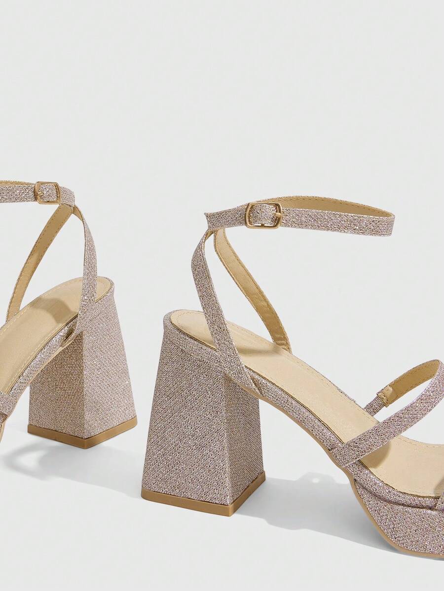 Women's high-heeled sandals with textured pattern, open toe design, chunky heel, and adjustable ankle buckle strap.