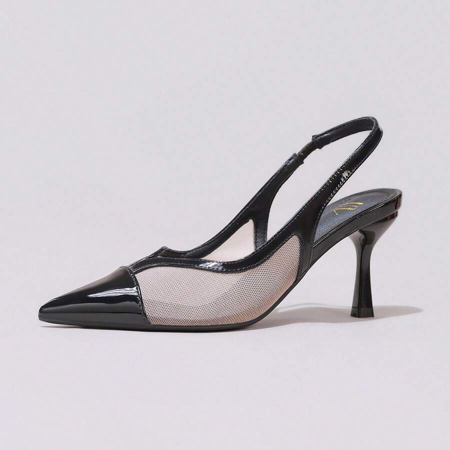 Pair of women's white pointed-toe kitten heel pumps with slingback straps and sleek patent finish