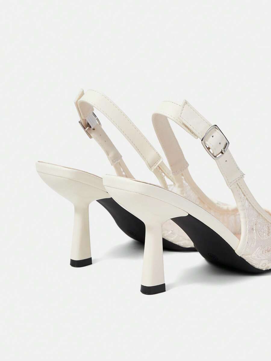 Pointed toe stiletto high heel pumps featuring black lace mesh upper, buckle slingback detail, and sleek slip-on design for weddings and evening wear.