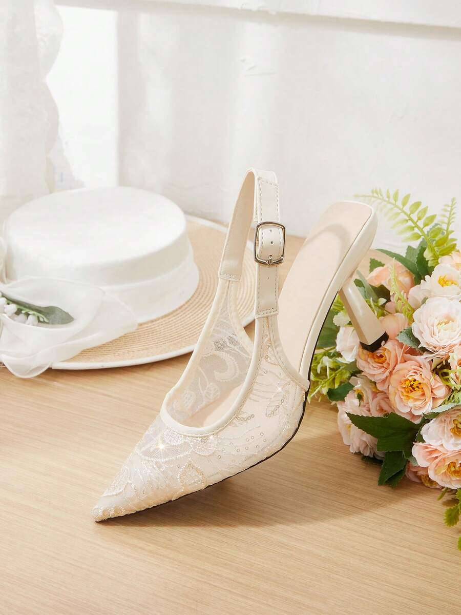 Pointed toe stiletto high heel pumps featuring black lace mesh upper, buckle slingback detail, and sleek slip-on design for weddings and evening wear.