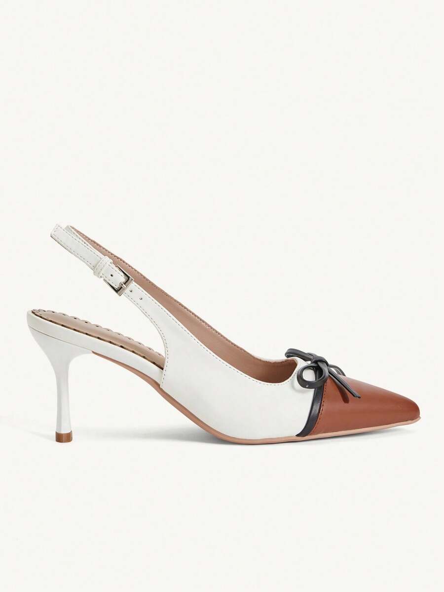 Pointed toe stiletto high heel pumps featuring black lace mesh upper, buckle slingback detail, and sleek slip-on design for weddings and evening wear.