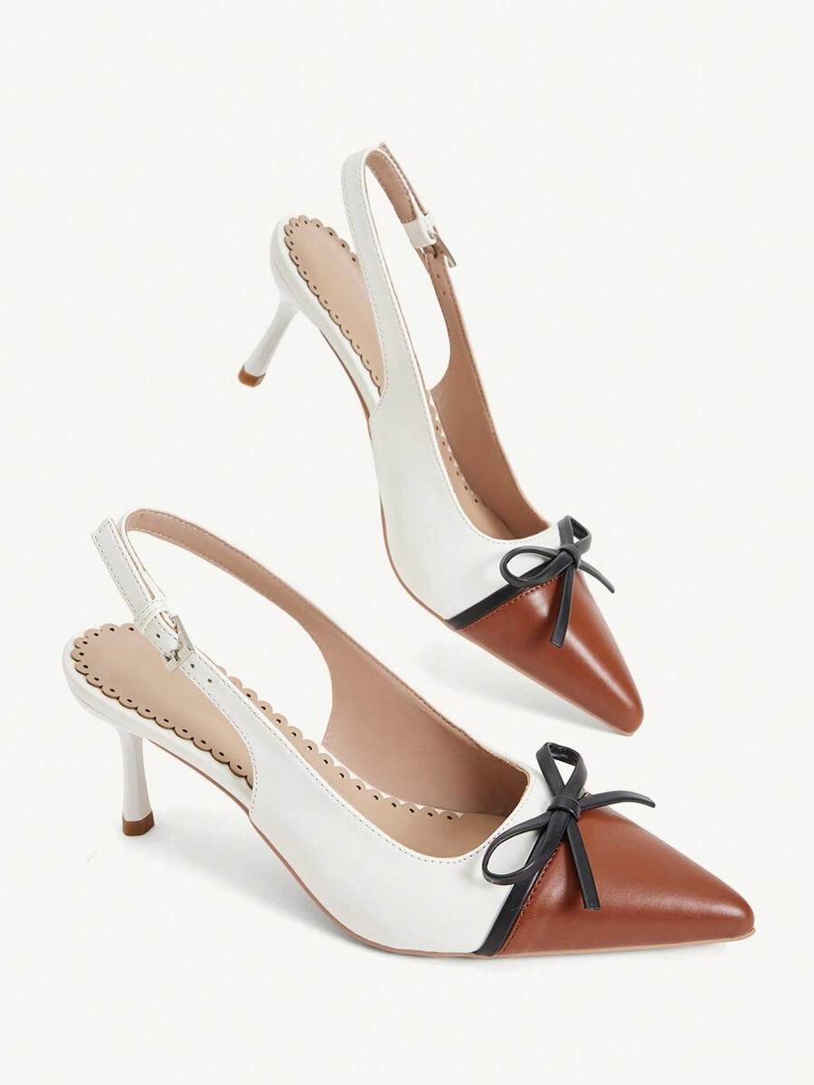 Pointed toe stiletto high heel pumps featuring black lace mesh upper, buckle slingback detail, and sleek slip-on design for weddings and evening wear.