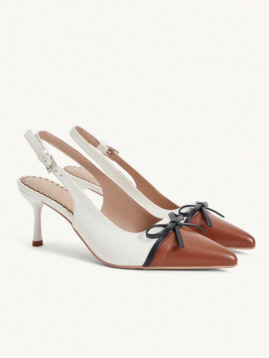 Pointed toe stiletto high heel pumps featuring black lace mesh upper, buckle slingback detail, and sleek slip-on design for weddings and evening wear.
