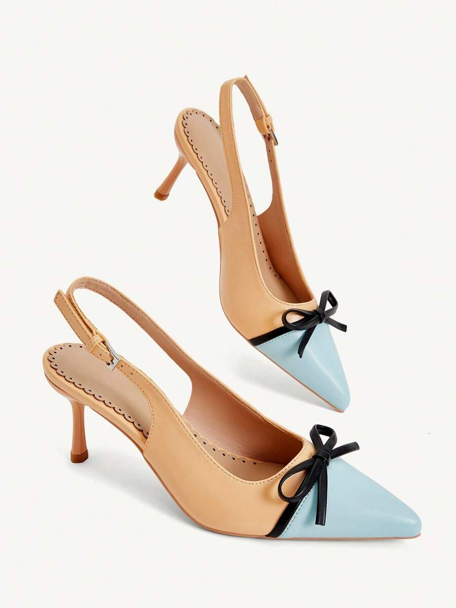 Pointed toe stiletto high heel pumps featuring black lace mesh upper, buckle slingback detail, and sleek slip-on design for weddings and evening wear.