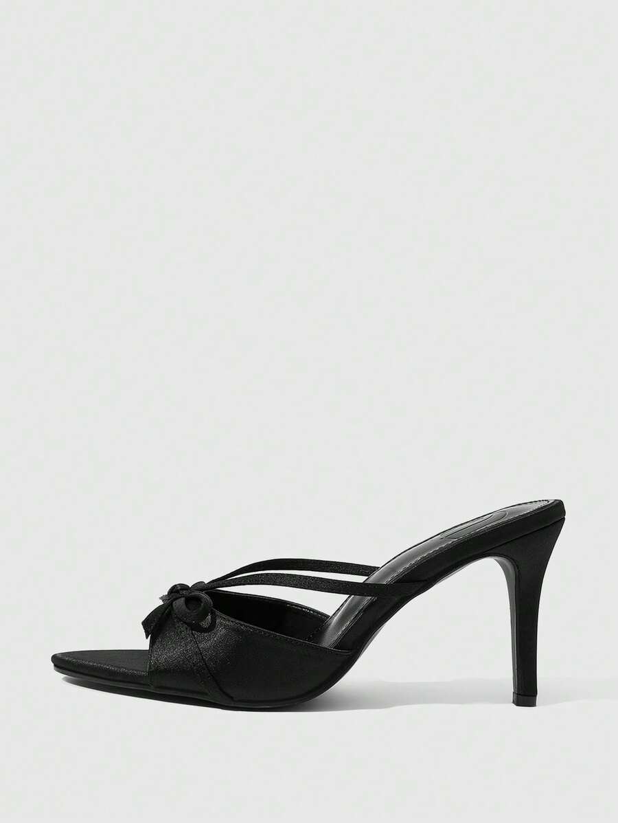 Women's brown flannel pointed open-toe heeled sandals featuring a slip-on mule design with high stiletto heels.
