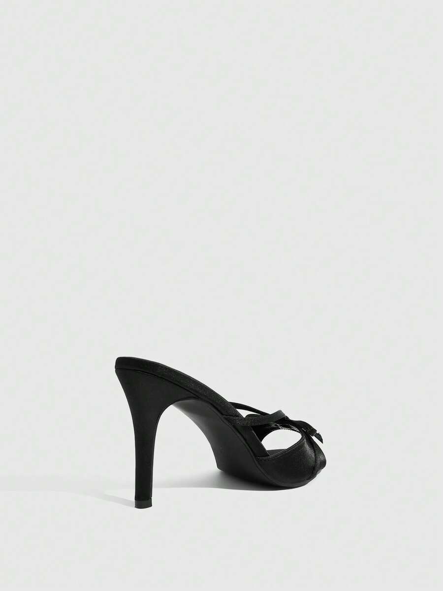 Women's brown flannel pointed open-toe heeled sandals featuring a slip-on mule design with high stiletto heels.