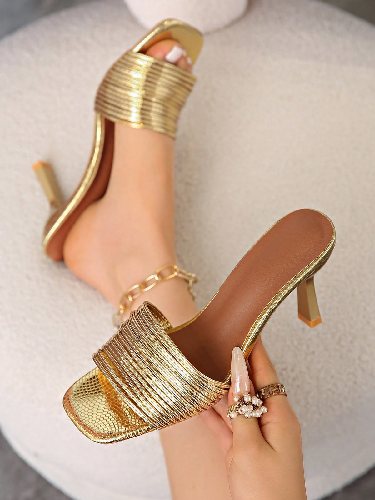 Women's pointed toe high heel mules with stiletto heels and slip-on strap design