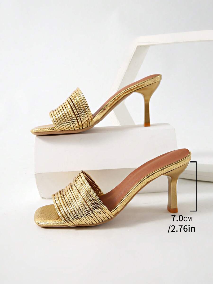Women's pointed toe high heel mules with stiletto heels and slip-on strap design