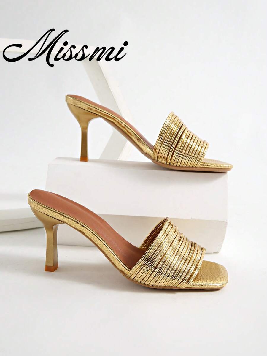 Women's pointed toe high heel mules with stiletto heels and slip-on strap design