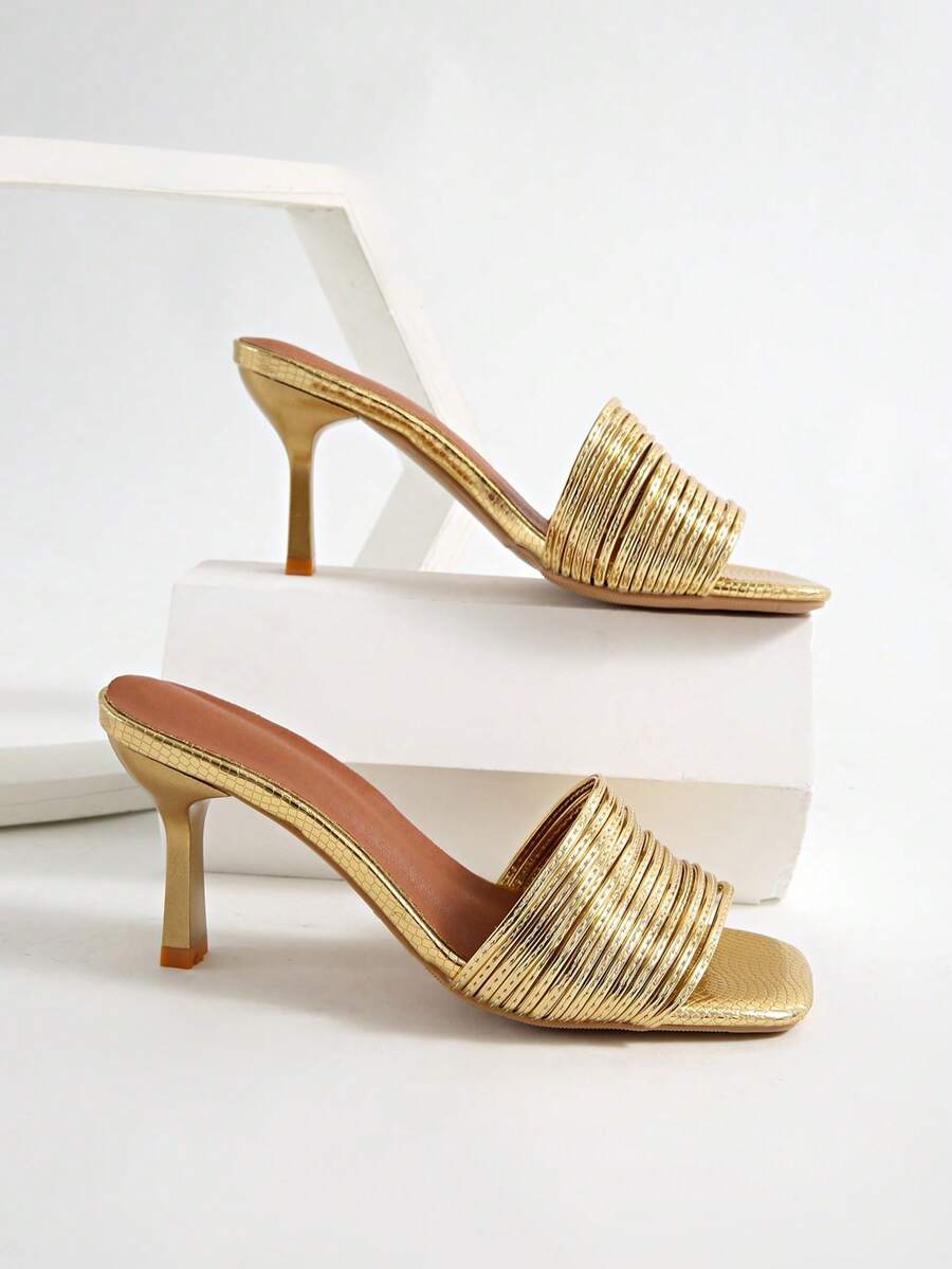 Women's pointed toe high heel mules with stiletto heels and slip-on strap design