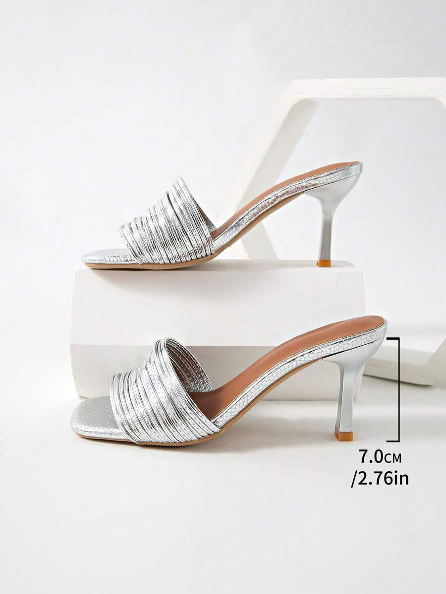 Women's pointed toe high heel mules with stiletto heels and slip-on strap design