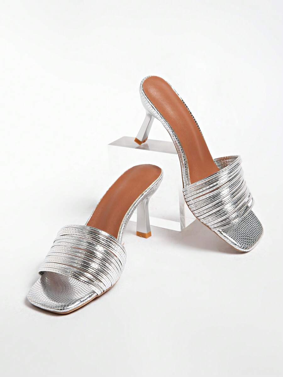 Women's pointed toe high heel mules with stiletto heels and slip-on strap design