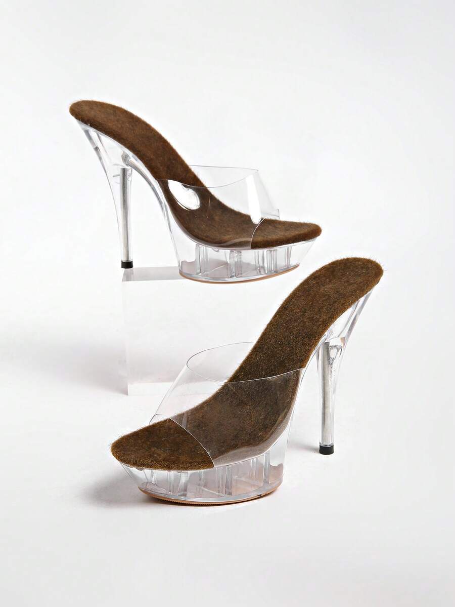Transparent chunky heel platform slide sandals for women featuring clear PVC upper, open toe design, and ultra high heels.