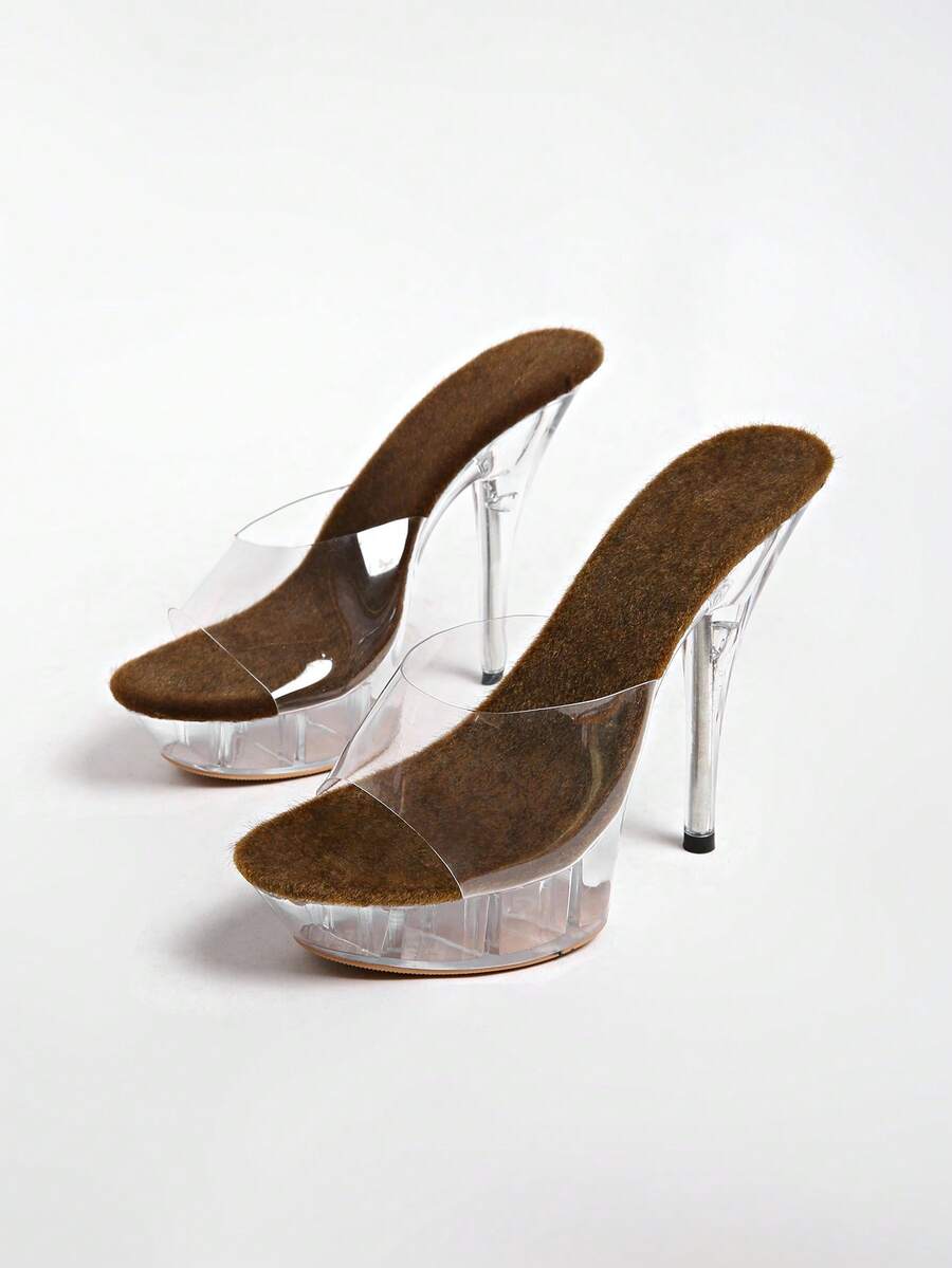 Transparent chunky heel platform slide sandals for women featuring clear PVC upper, open toe design, and ultra high heels.