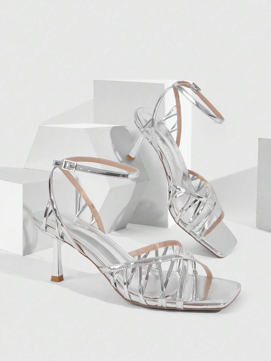 Women's open toe stiletto heel sandals featuring square toe design, criss-cross rhinestone slim straps, and secure ankle strap.