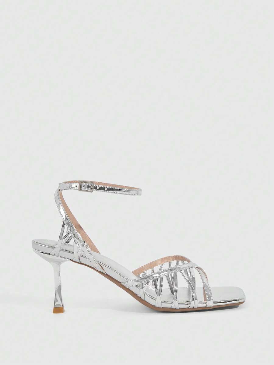 Women's open toe stiletto heel sandals featuring square toe design, criss-cross rhinestone slim straps, and secure ankle strap.