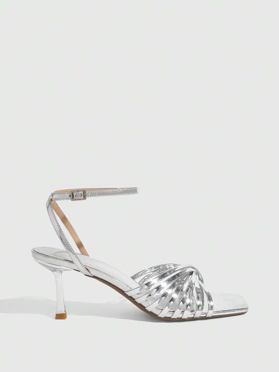 Women's open toe stiletto heel sandals featuring square toe design, criss-cross rhinestone slim straps, and secure ankle strap.