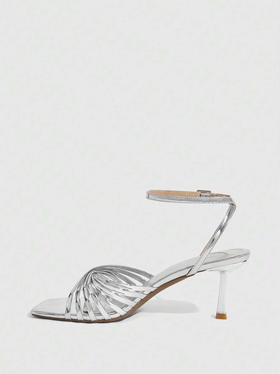 Women's open toe stiletto heel sandals featuring square toe design, criss-cross rhinestone slim straps, and secure ankle strap.