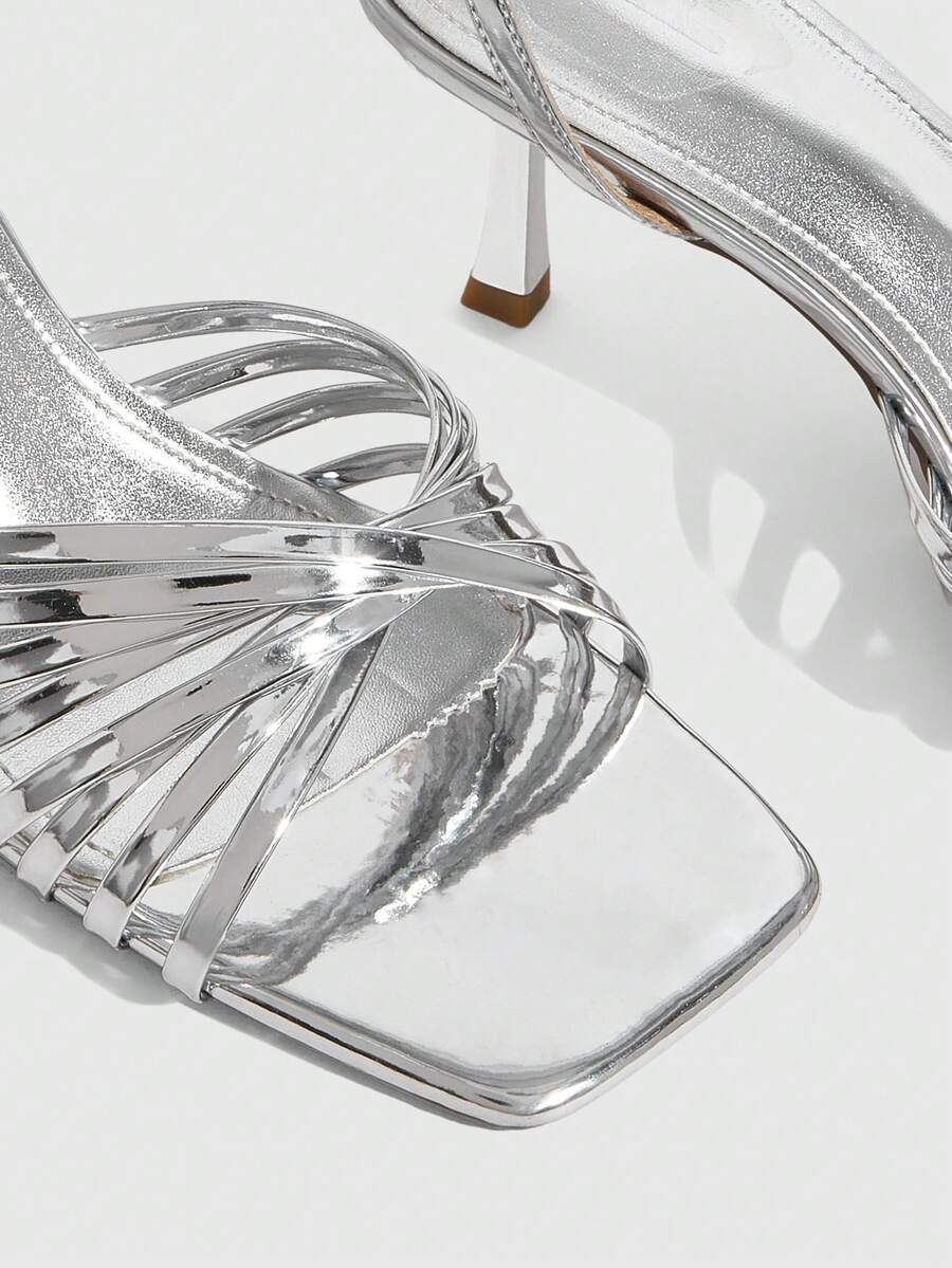 Women's open toe stiletto heel sandals featuring square toe design, criss-cross rhinestone slim straps, and secure ankle strap.
