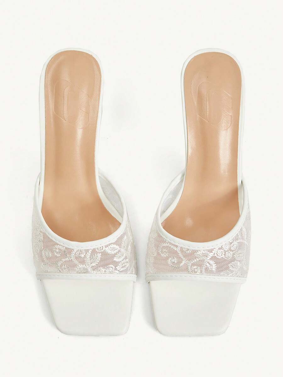 Women's square toe stiletto high heel slide sandals featuring contrast mesh embroidery and an open-toe backless design.
