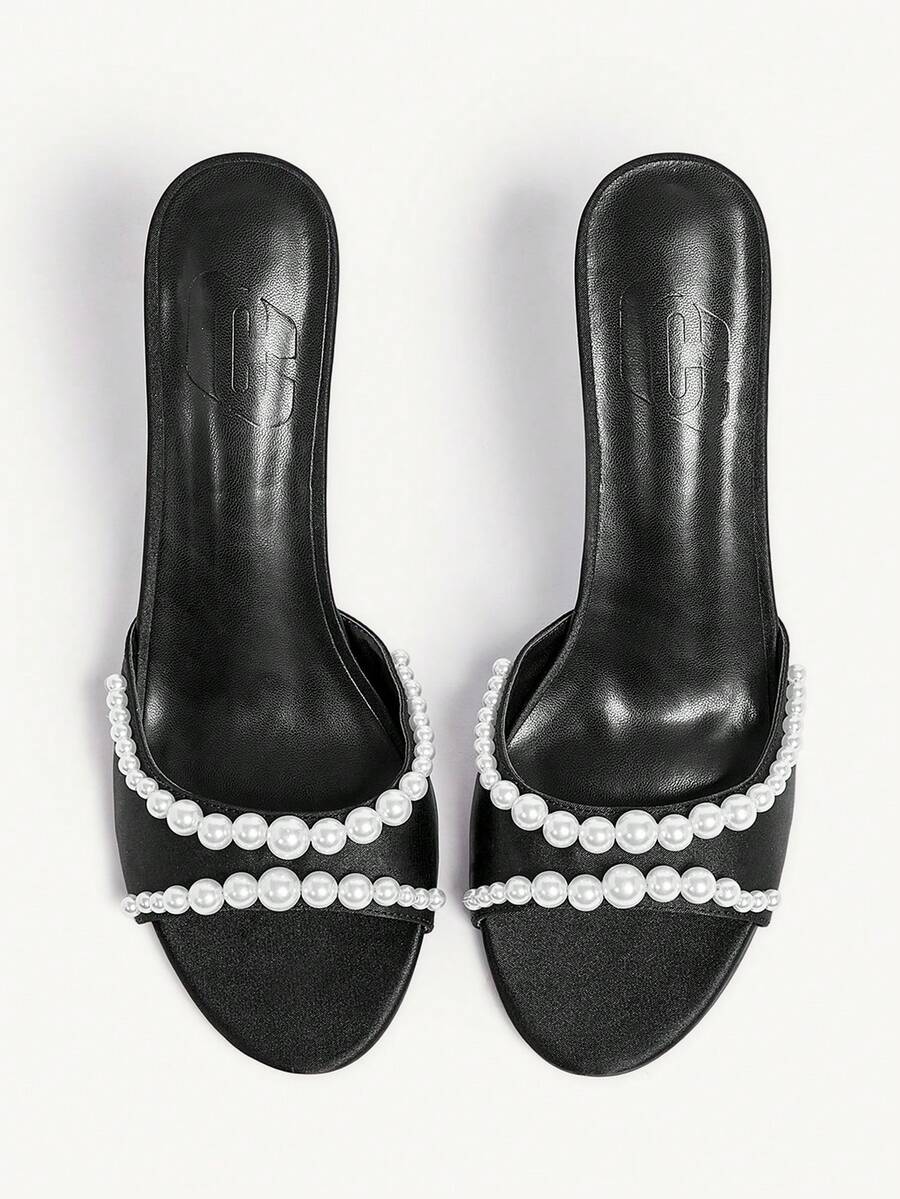 Elegant women's satin high heel sandals with pearl embellishments, stiletto heels, and slingback straps for bridal and wedding wear.
