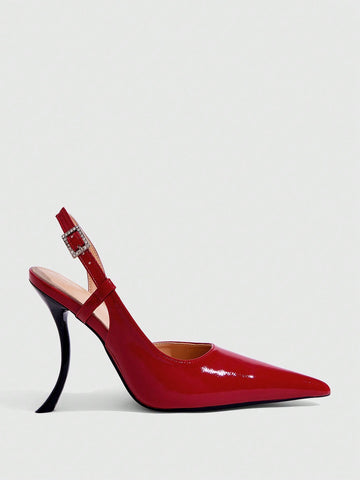 Red women's pointed-toe high heel sandals featuring a sculptural heel, rear slingback strap, and decorative buckle detail.