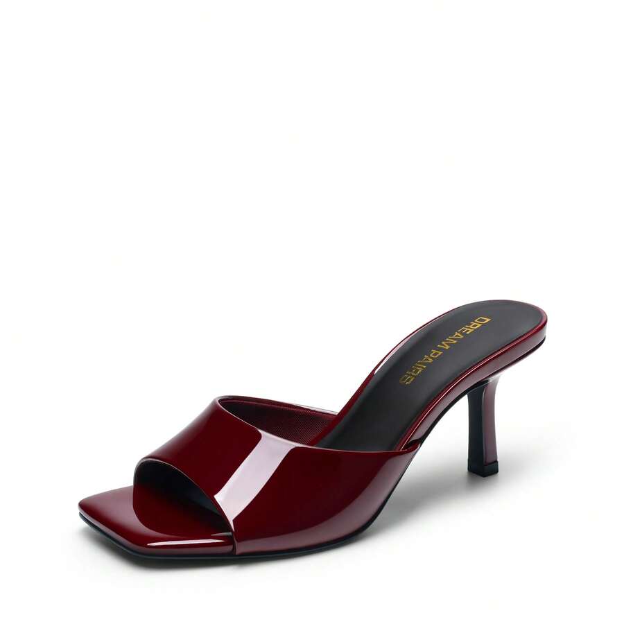 Pair of women's open square toe kitten heel mule sandals in white PU leather with slip-on styling.
