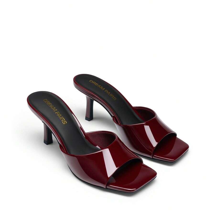 Pair of women's open square toe kitten heel mule sandals in white PU leather with slip-on styling.