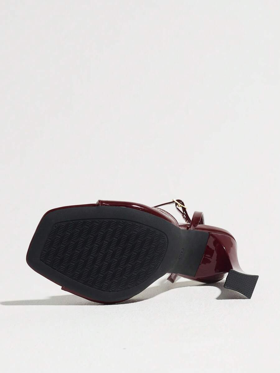 Burgundy women's square toe high heel sandals featuring a mesh bow accent and ankle strap buckle on an open toe silhouette