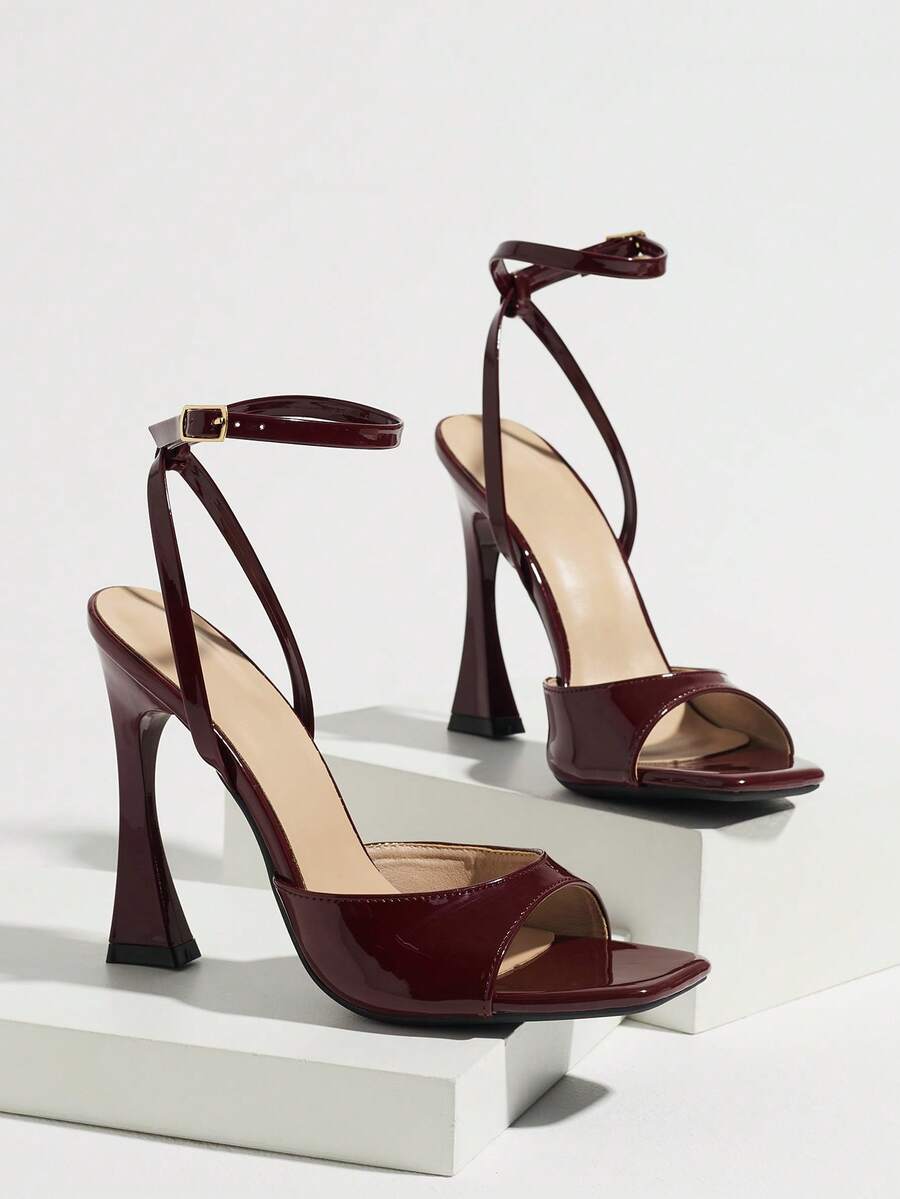 Burgundy women's square toe high heel sandals featuring a mesh bow accent and ankle strap buckle on an open toe silhouette