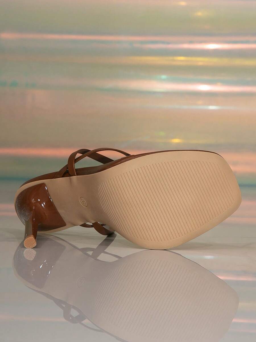 Women's stiletto high heel thong sandals featuring a T-strap toe loop design and ankle buckle strap