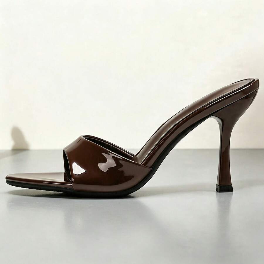 Women's open toe high heel sandals and slides featuring a slip-on design and mid pyramid heel.