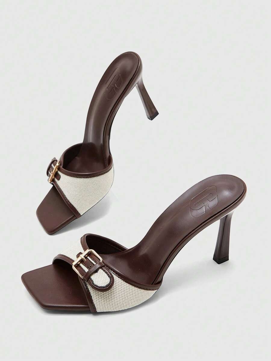 Women's brown open-toe slingback heeled sandals with stiletto heel and buckle strap.